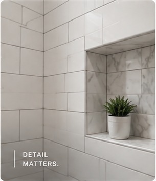 Finished tile and stone wall detail showing precise renovation craftsmanship